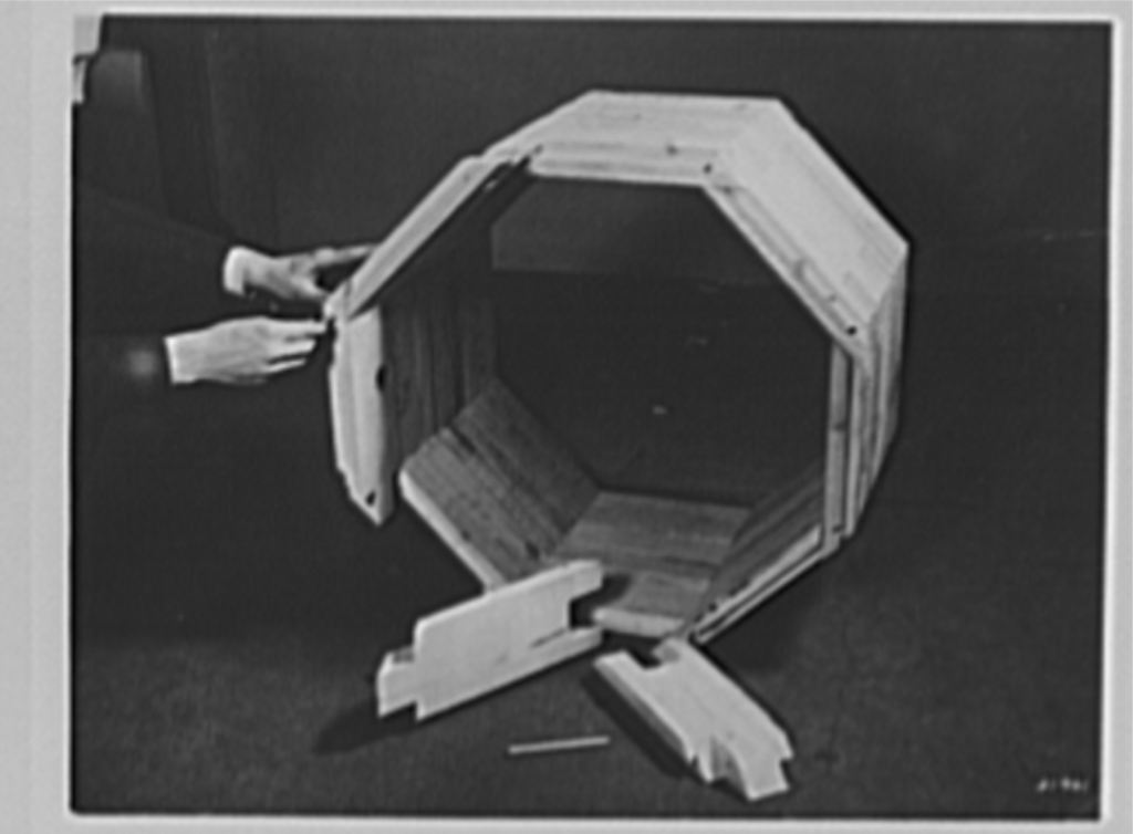 1942 - A wooden pipe used in place of corrugated metal pipe and concrete pipe. These pipes are made of sections cut from short lengths of wood. Locking of adjacent rings with hardwood dowel pins produces a flexible structure (Source: Library of Congress)